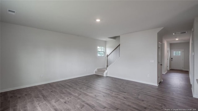 empty room featuring dark hardwood / wood-style flooring