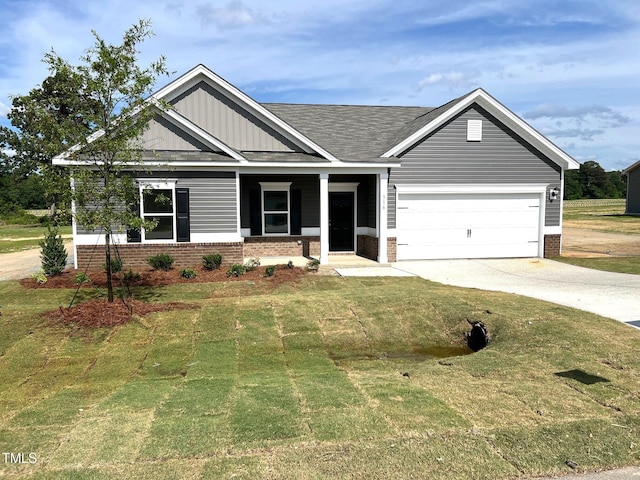 view of front of house featuring brick siding, driveway, and a front lawn