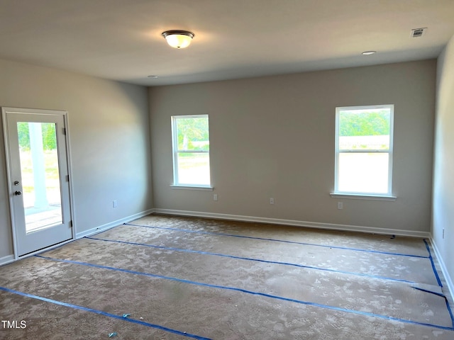 empty room featuring plenty of natural light