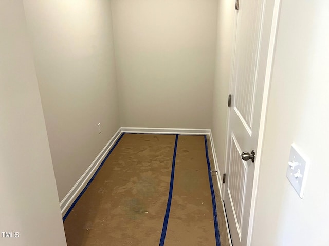 doorway featuring baseboards
