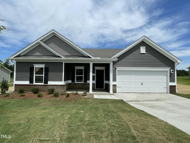 316 Olivia Crossing Ct Unit 11, Four Oaks, NC 27524 - view of front of home featuring concrete driveway, a front lawn, a garage, and brick siding