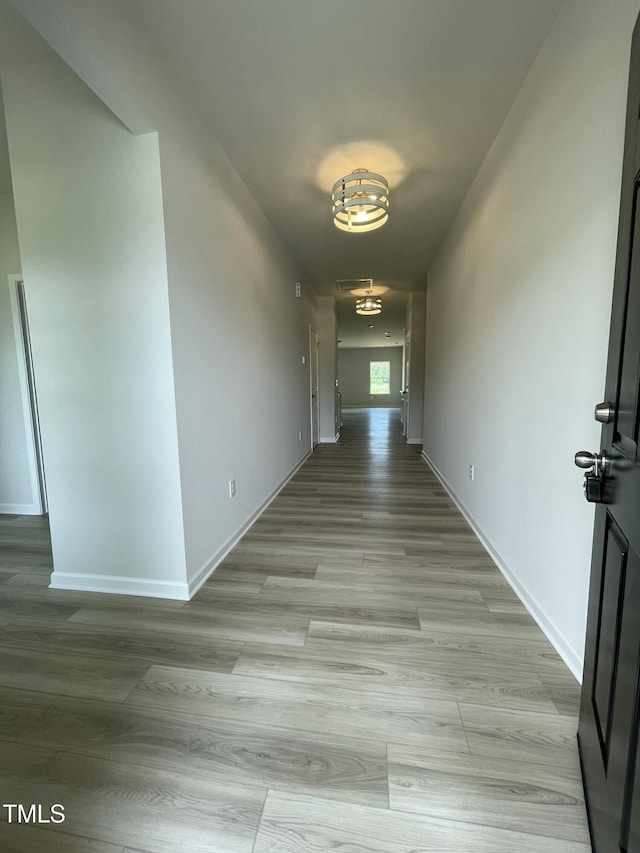 316 Olivia Crossing Ct Unit 11, Four Oaks, NC 27524 - hallway featuring light wood-type flooring and baseboards