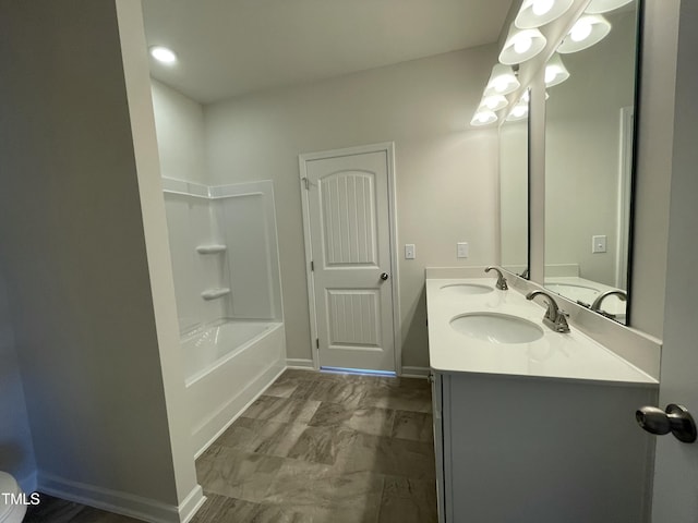 316 Olivia Crossing Ct Unit 11, Four Oaks, NC 27524 - bathroom with double vanity, baseboards, and shower / washtub combination