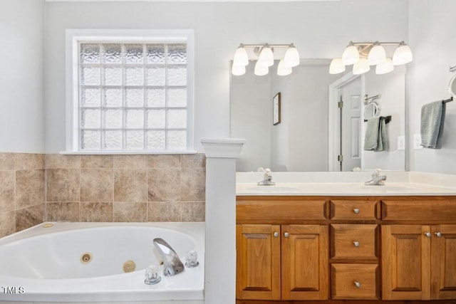 full bath with a jetted tub, double vanity, and a sink