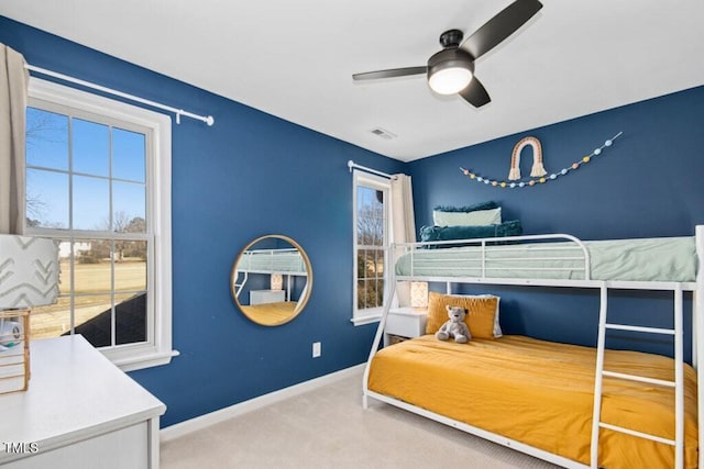 bedroom featuring carpet, visible vents, ceiling fan, and baseboards