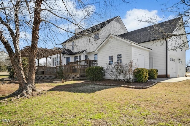 view of property exterior featuring a deck and a yard