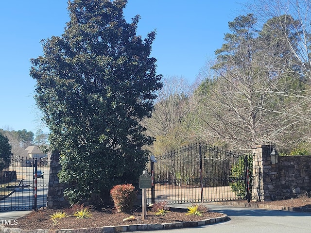 view of gate with fence