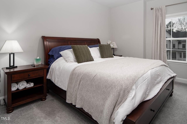 bedroom featuring baseboards and carpet floors