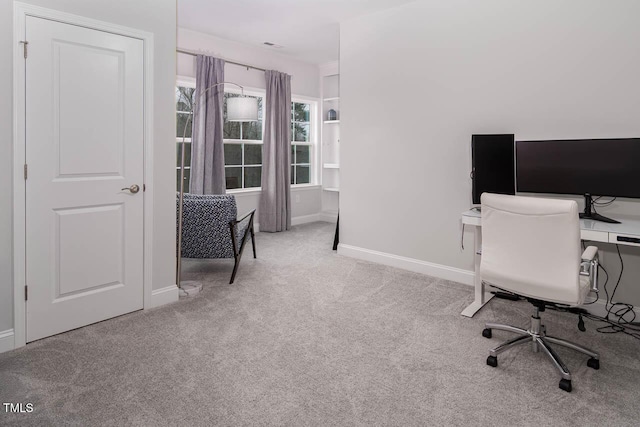 carpeted office with baseboards