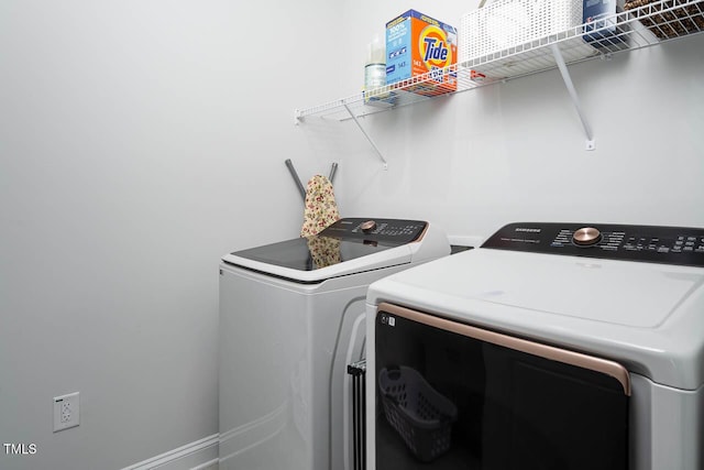 laundry area with washer and clothes dryer and laundry area