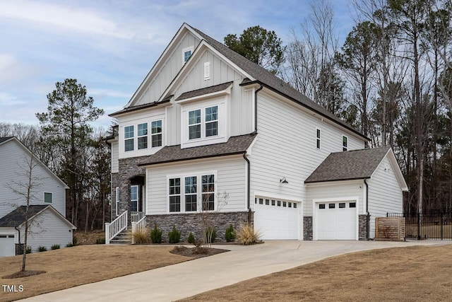 craftsman inspired home featuring a garage, board and batten siding, and a shingled roof