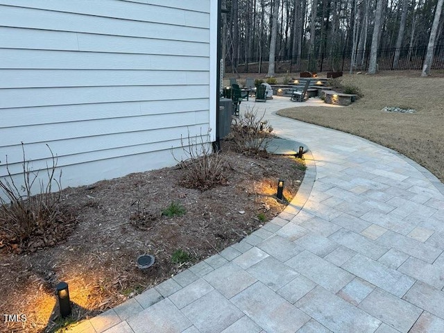 view of yard with cooling unit and a patio