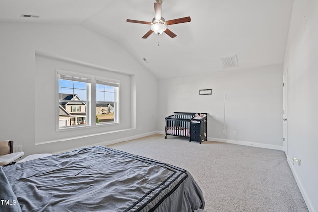 carpeted bedroom with vaulted ceiling, a ceiling fan, visible vents, and baseboards