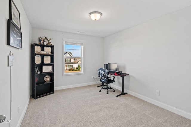 unfurnished office with carpet and baseboards