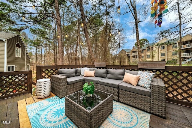 wooden deck featuring outdoor lounge area