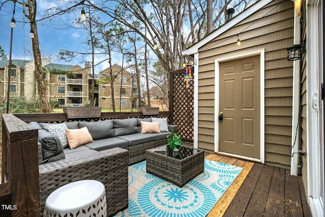 deck featuring outdoor lounge area