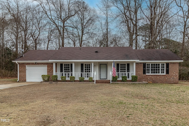 single story home with a garage, driveway, covered porch, a front lawn, and brick siding