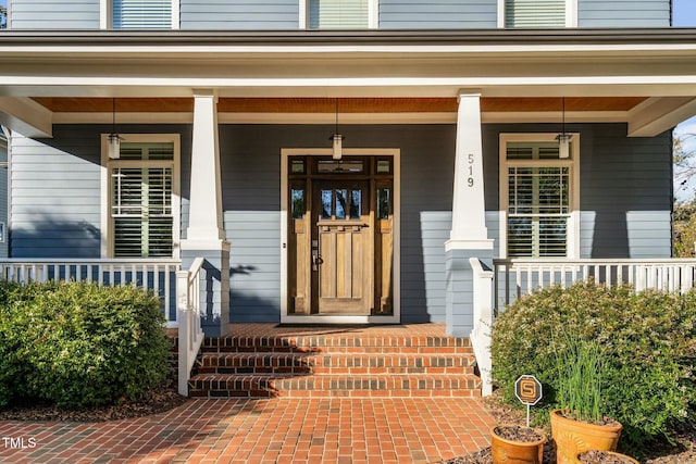 property entrance featuring covered porch