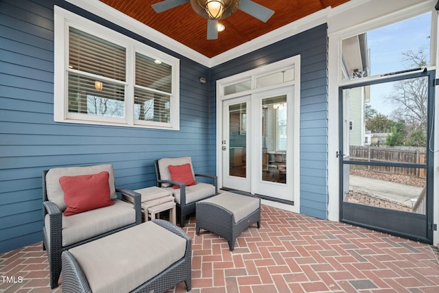 view of patio / terrace featuring a ceiling fan, french doors, and fence