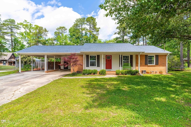 single story home with a porch, brick siding, a carport, driveway, and a shingled roof