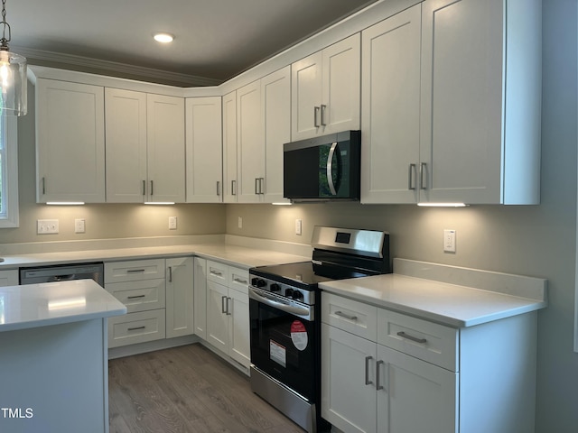 162 Kirkwall Ln, Selma, NC 27576 - kitchen featuring light countertops, wood finished floors, and appliances with stainless steel finishes