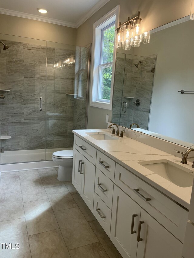 162 Kirkwall Ln, Selma, NC 27576 - bathroom featuring a sink, a shower stall, double vanity, and crown molding