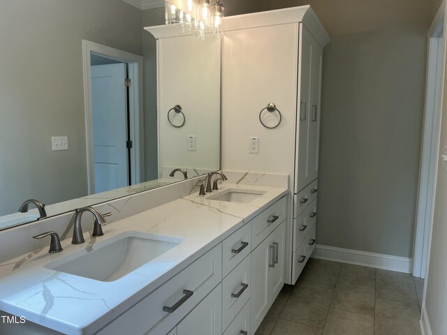 162 Kirkwall Ln, Selma, NC 27576 - bathroom featuring tile patterned floors, baseboards, a sink, and double vanity