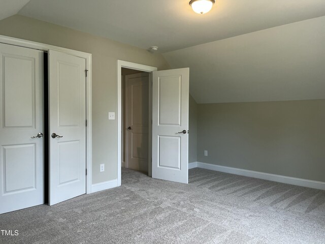 162 Kirkwall Ln, Selma, NC 27576 - bonus room with lofted ceiling, carpet flooring, and baseboards