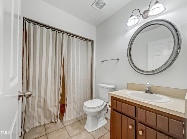 bathroom with toilet, tile patterned flooring, visible vents, and vanity