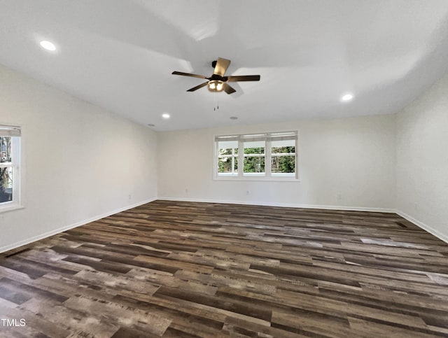 unfurnished room with lofted ceiling, dark wood finished floors, a ceiling fan, and recessed lighting