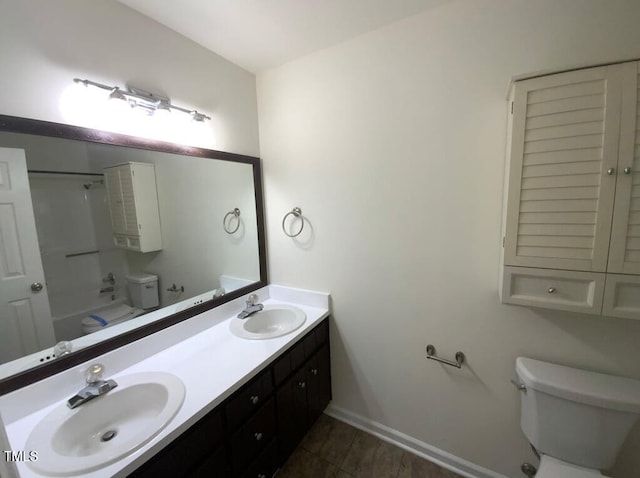 308 Trimble Ave, Cary, NC 27511 - bathroom featuring double vanity, shower / bathtub combination, and tile patterned flooring