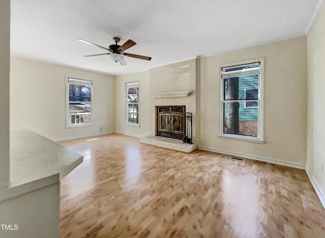 308 Trimble Ave, Cary, NC 27511 - unfurnished living room featuring wood finished floors, a ceiling fan, and a fireplace