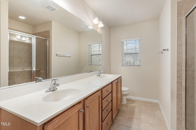 bathroom with visible vents, a sink, toilet, and tile patterned floors