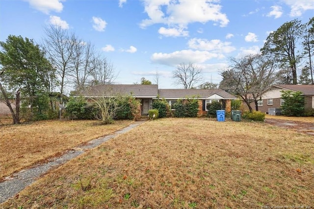 ranch-style house with a front yard