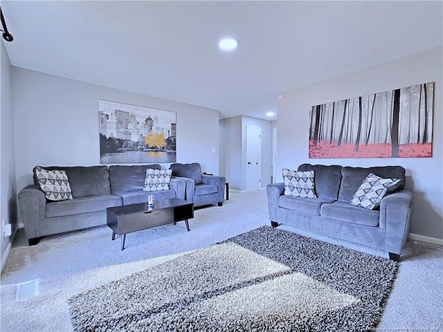 living room with baseboards, carpet, and visible vents