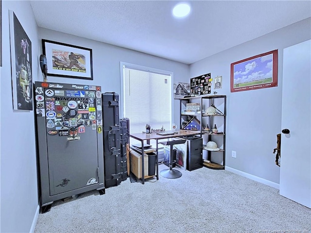 carpeted office space featuring baseboards