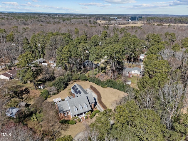 bird's eye view featuring a wooded view