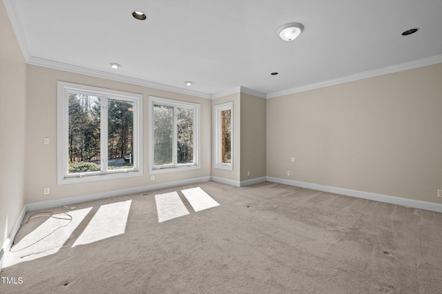 unfurnished room with recessed lighting, light colored carpet, crown molding, and baseboards