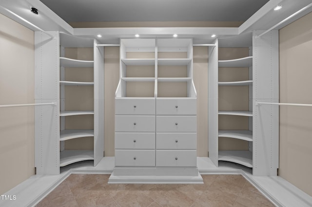 spacious closet featuring tile patterned flooring