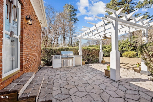 view of patio with a grill, area for grilling, and a pergola