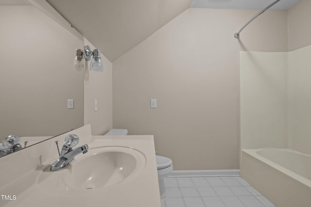 full bathroom with tile patterned flooring, toilet, baseboards, vaulted ceiling, and tub / shower combination