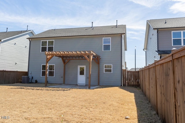 rear view of house with central air condition unit, a patio area, a fenced backyard, and a pergola