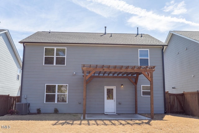 rear view of property featuring a fenced backyard, a pergola, and a yard