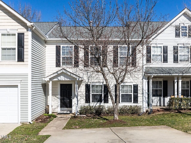 townhome / multi-family property featuring a garage