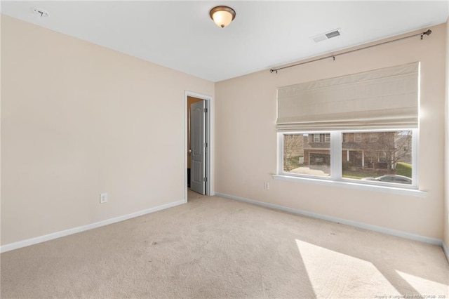 unfurnished room featuring light carpet, baseboards, and visible vents