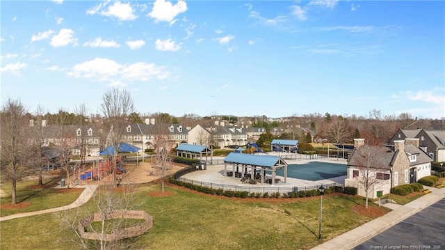 exterior space with a residential view and a yard