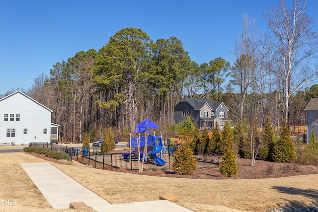 community jungle gym featuring fence