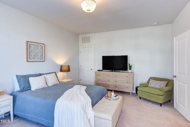 bedroom with light carpet and visible vents