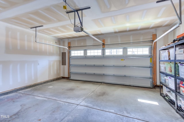 garage featuring electric panel and a garage door opener