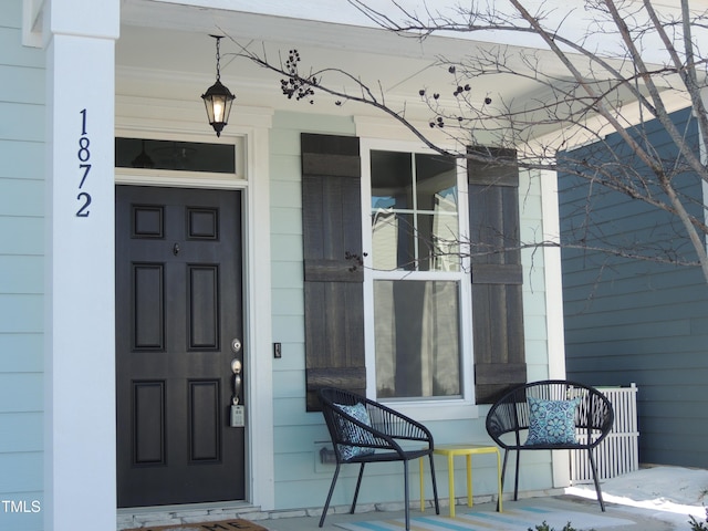 doorway to property featuring a porch